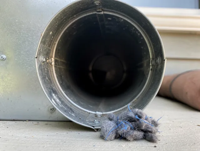 Tolland Dryer Vent Cleaning technician using specialized equipment to clear severe dryer vent blockage in Tolland